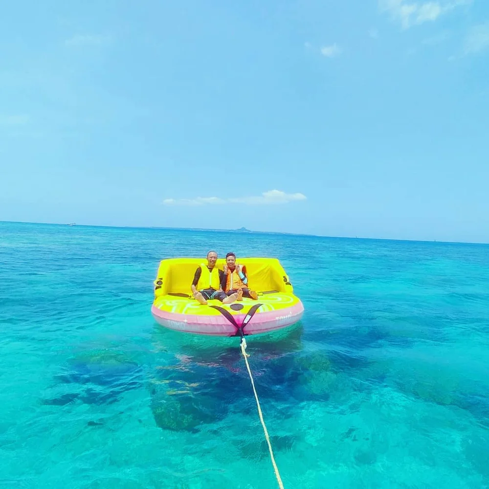 Sea Surface Gliding in Okinawa’s Sesokojima Area! Banana Boat or Big Mable Experience